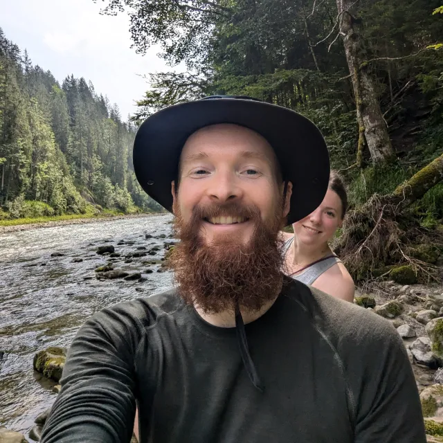 Selfie during a break from hiking on a river.